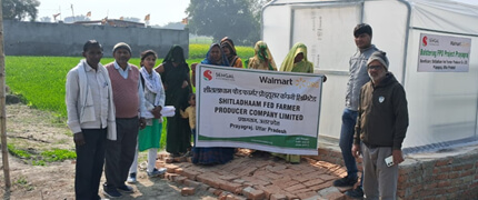 Farmers at the solar drying unit